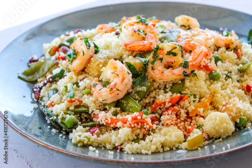 Couscous with vegetables and king prawns.