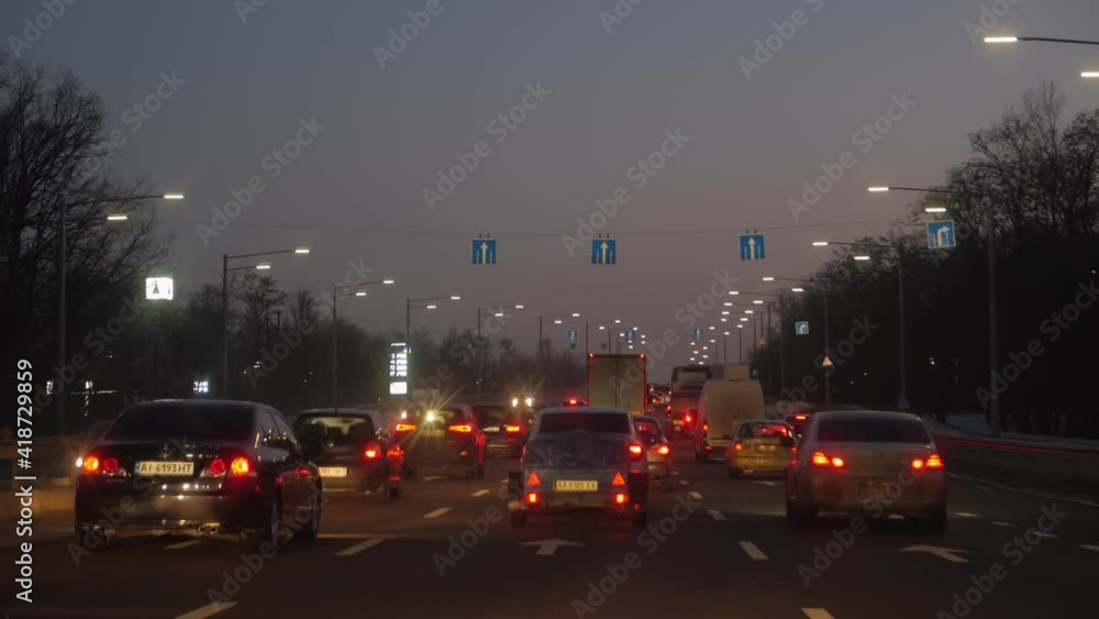 Night city traffic jam lights view from driving car Night city traffic jam lights view from driving car