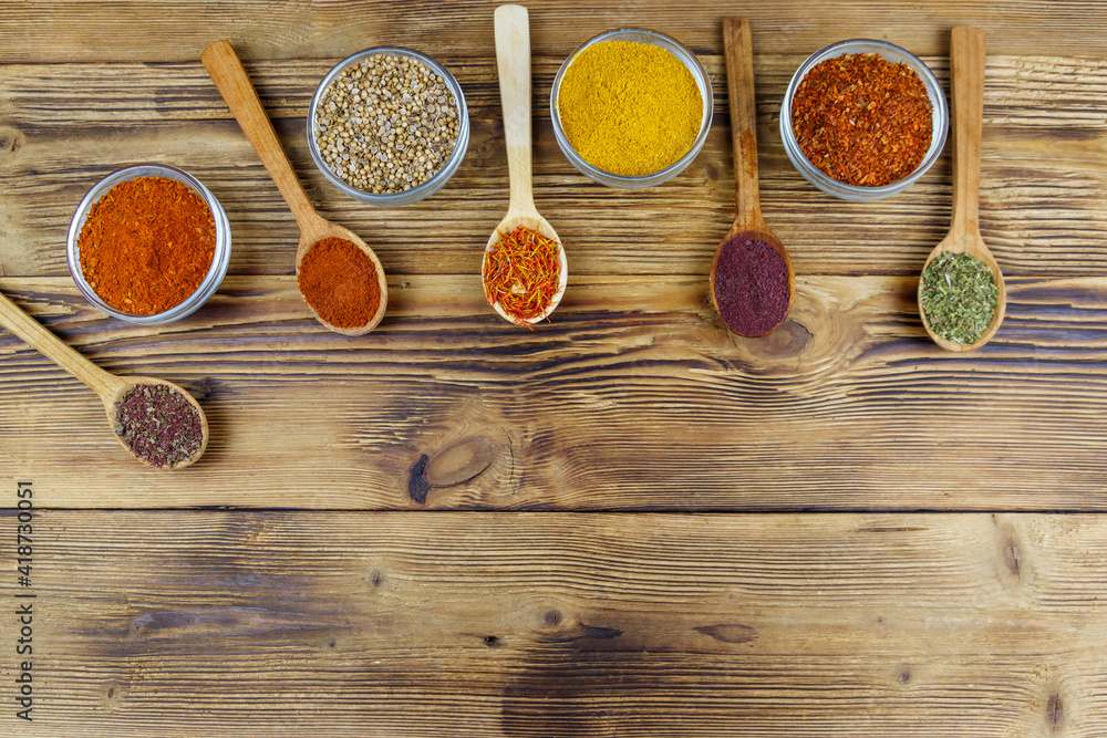 Set of different aromatic spices on wooden table. Top view, copy space Set of different aromatic spices on wooden table. Top view, copy space