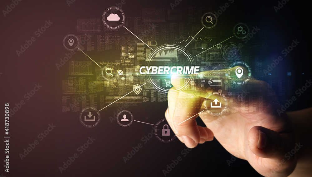 Hand touching CYBERCRIME inscription, Cybersecurity concept Hand touching CYBERCRIME inscription, Cybersecurity concept