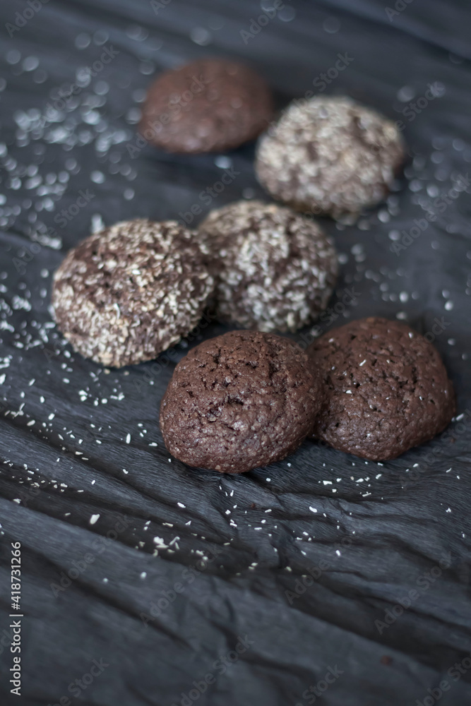 Chocolate chip cookies with coconut. Lie on a black and gray background. Chocolate chip cookies with coconut. Lie on a black and gray background.
