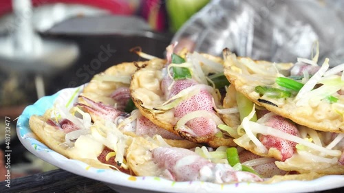 Plate finished banhxeo traditional Vietnamese squid sizzling pancake smoking hot photo