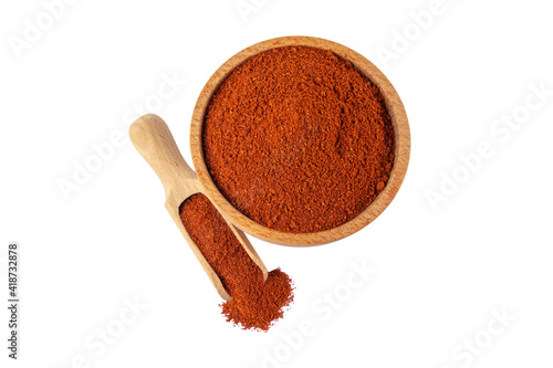 Tandoori Masala mix of spices in wooden bowl and scoop isolated on white background. Spices and food ingredients.