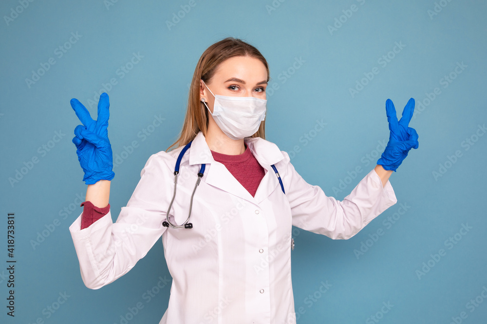Portrait of a female doctor on a blue background Portrait of a female doctor on a blue background