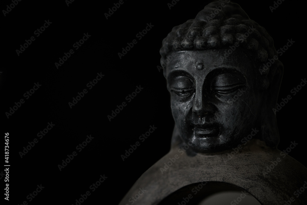 Buddha sculpture isolated on black background Buddha sculpture isolated on black background