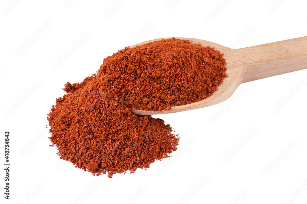 Tandoori Masala mix of spices in wooden spoon isolated on white background. Spices and food ingredients. Tandoori Masala mix of spices in wooden spoon isolated on white background. Spices and food ingredients.
