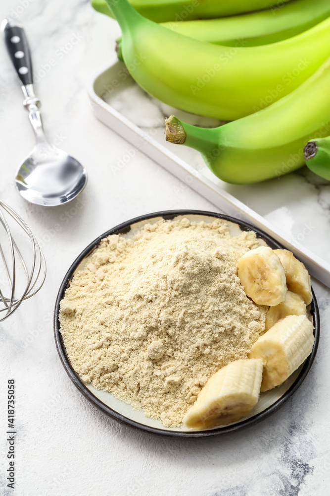 Plate with banana flour on light background Plate with banana flour on light background
