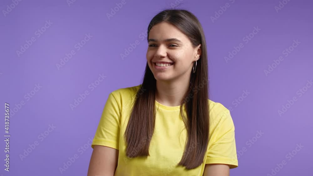 Pretty woman showing gesture of nonsense, not serious. You're kidding, no way. Girls reaction to pleasant compliment over violet background. Pretty woman showing gesture of nonsense, not serious. You're kidding, no way. Girls reaction to pleasant compliment over violet background.