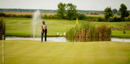 Young man playing golf