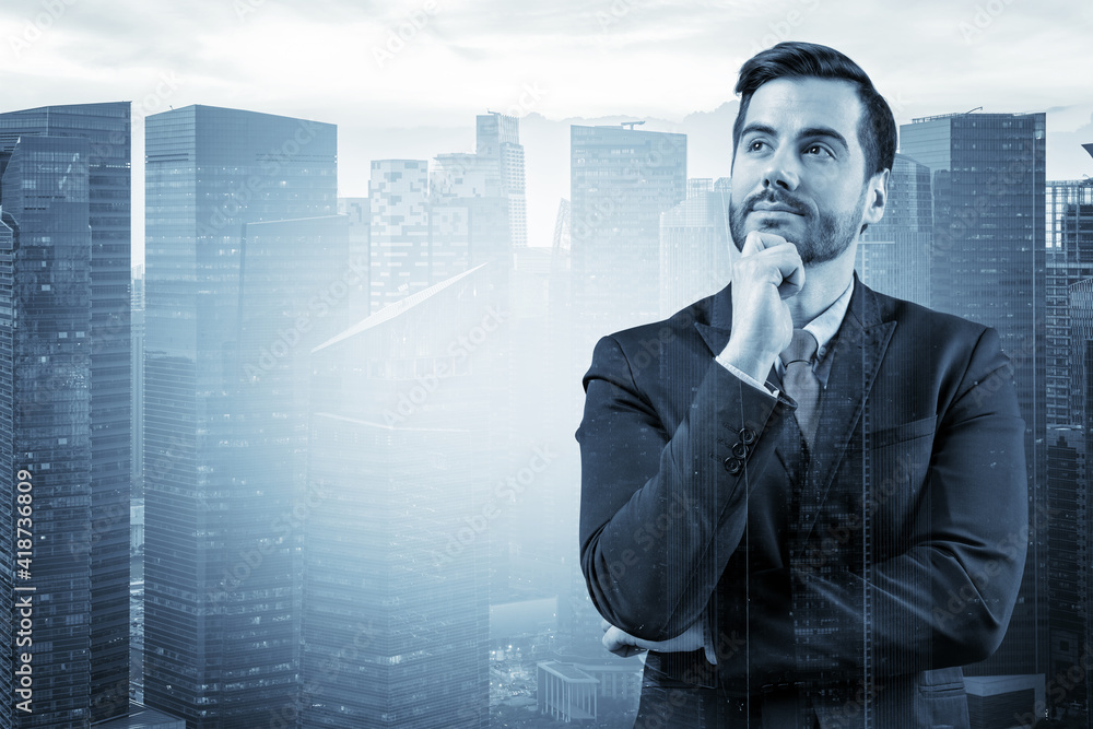 Young handsome businessman in suit with hand on chin thinking how to succeed, new career opportunities, MBA. Singapore on background. Double exposure. Young handsome businessman in suit with hand on chin thinking how to succeed, new career opportunities, MBA. Singapore on background. Double exposure.