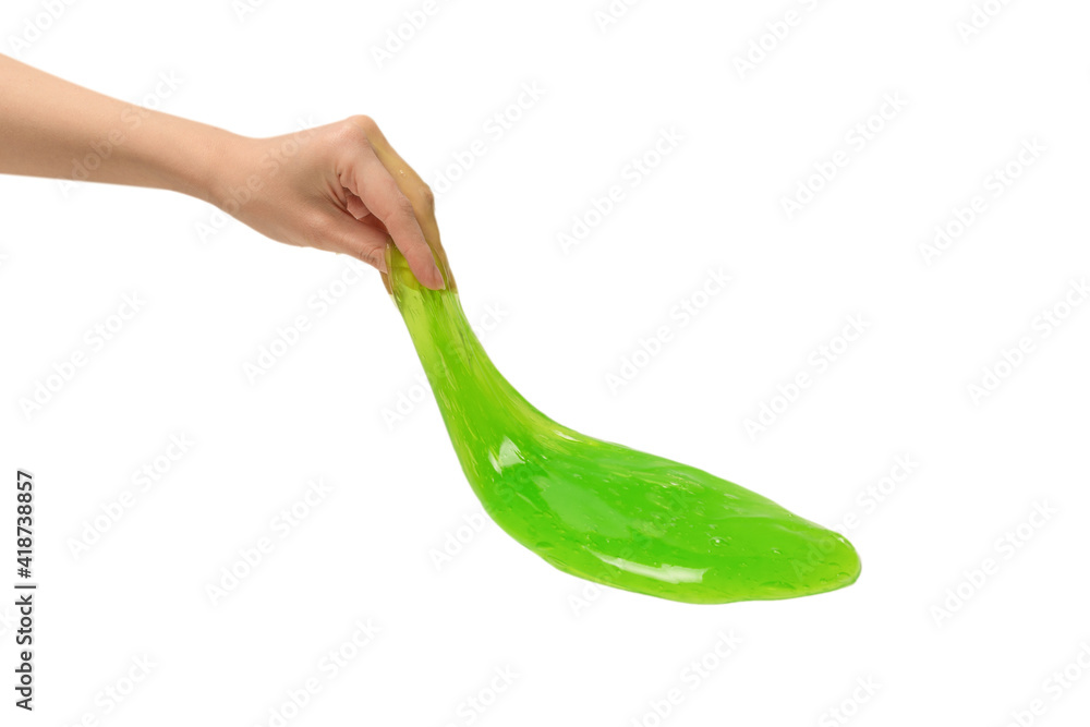 Green slime toy in woman hand isolated on white background. Green slime toy in woman hand isolated on white background.