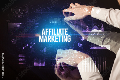 Businessman touching huge screen with AFFILIATE MARKETING inscription, cyber business concept