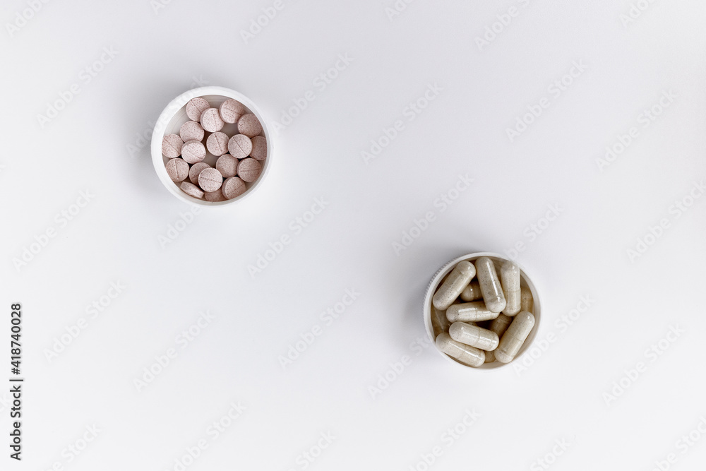 close-up of vitamin B-12 (methylcobalamin+dibencozide) chewable tablets and vitamin B6 (pyridoxal-5-phosphate) capsules. dietary concept. dietary supplement topview photo close-up of vitamin B-12 (methylcobalamin+dibencozide) chewable tablets and vitamin B6 (pyridoxal-5-phosphate) capsules. dietary concept. dietary supplement topview photo