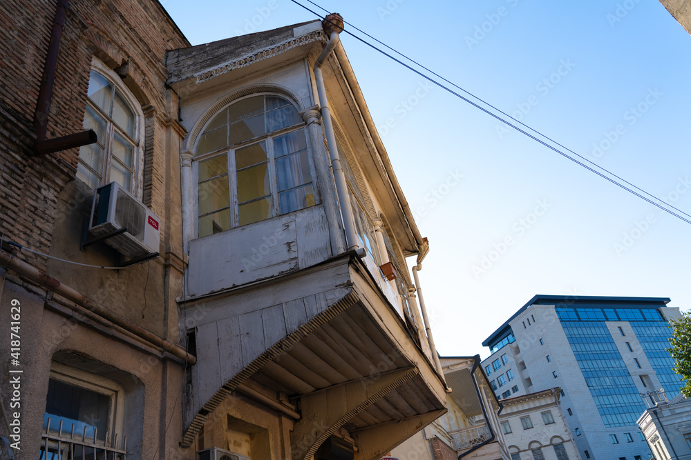 Wooden patterned balcony view from the street Wooden patterned balcony view from the street