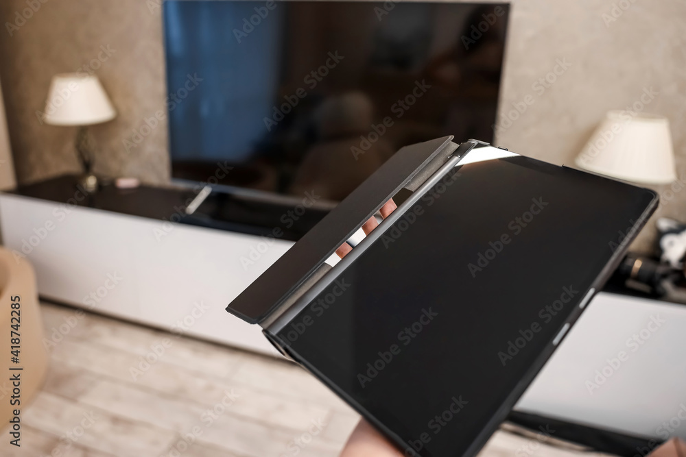Female hands hold a digital tablet close-up, top view. New technology concept, multimedia. Female hands hold a digital tablet close-up, top view. New technology concept, multimedia.