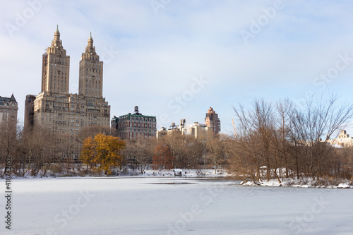 Beautiful Frozen Lake with Snow at Central Park in New York City during Winter with the Upper West Side Skyline