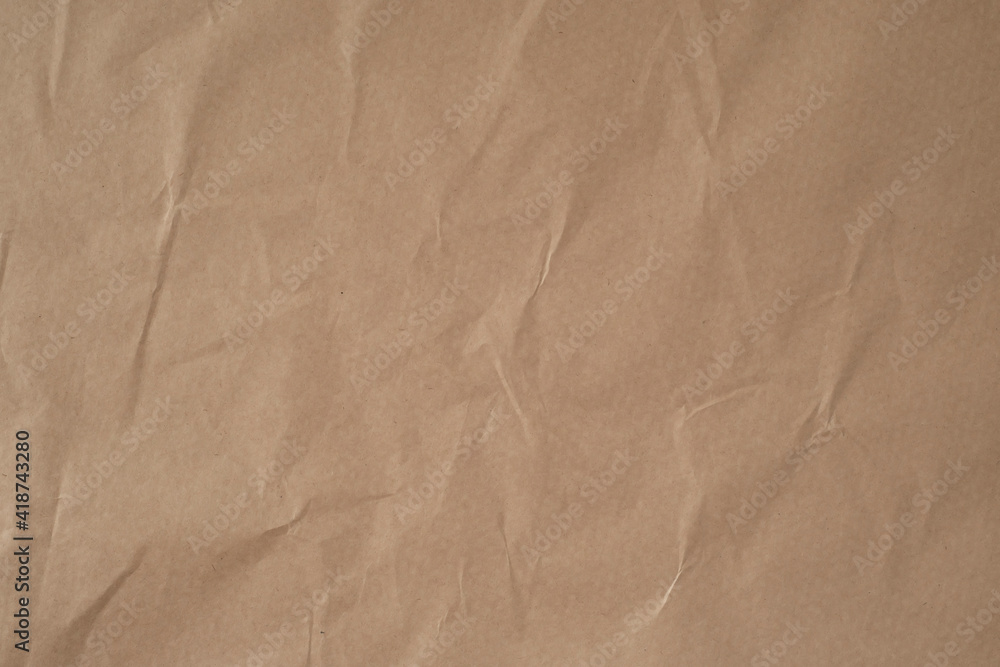 Fototapeta premium Background from crumpled brown paper.