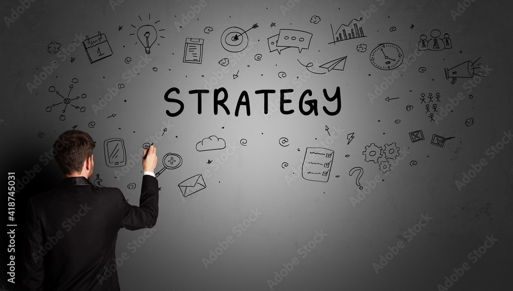 businessman drawing a creative idea sketch with STRATEGY inscription, business strategy concept businessman drawing a creative idea sketch with STRATEGY inscription, business strategy concept