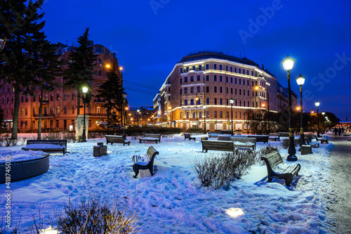 Mytninskaya embankment, a cozy square. New Year's night St. Petersburg. The Arrow of Vasilyevska Island photo