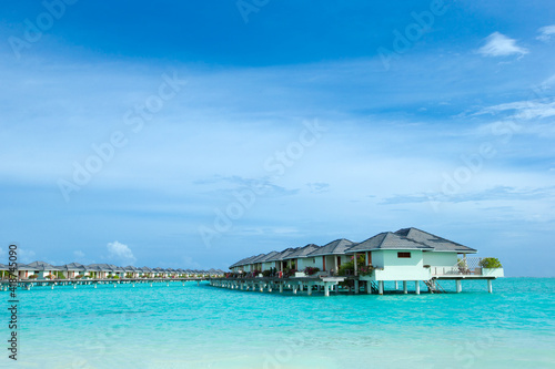 Beautiful tropical Maldives island with beach. Sea with water bungalows © Pakhnyushchyy