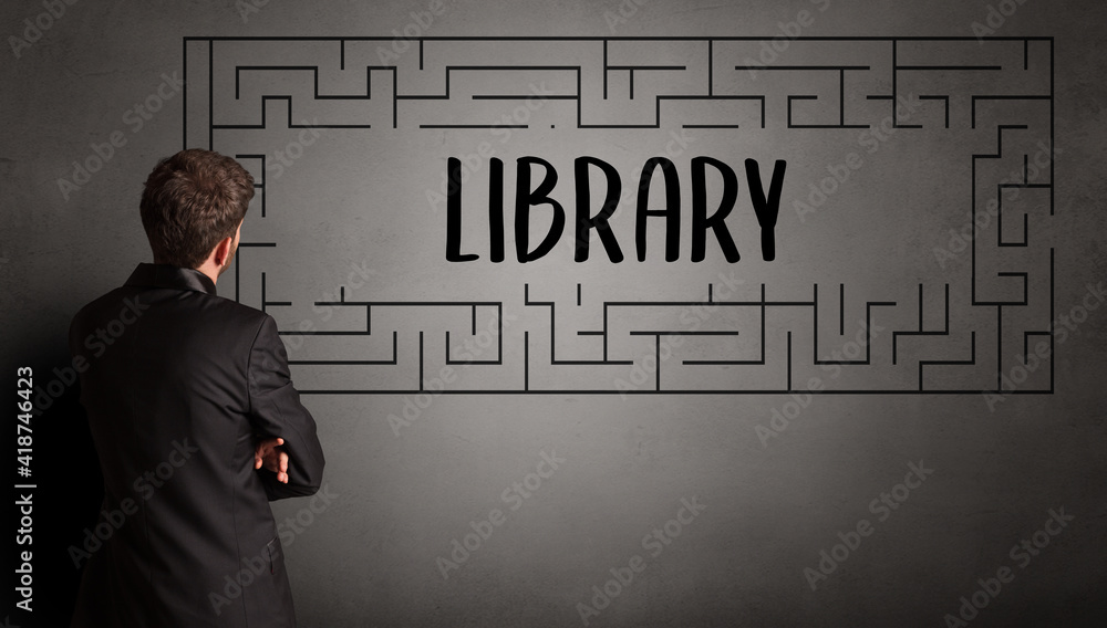 businessman drawing maze with LIBRARY inscription, business education concept