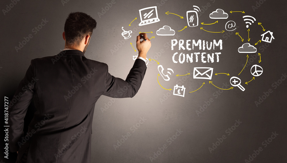 businessman drawing social media icons with PREMIUM CONTENT inscription, new media concept businessman drawing social media icons with PREMIUM CONTENT inscription, new media concept