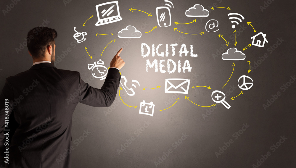 businessman drawing social media icons with DIGITAL MEDIA inscription, new media concept businessman drawing social media icons with DIGITAL MEDIA inscription, new media concept