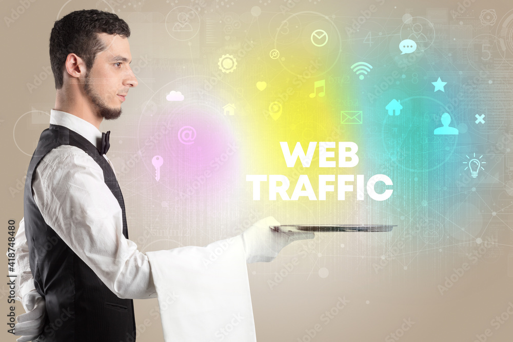 Waiter serving social networking with WEB TRAFFIC inscription, new media concept Waiter serving social networking with WEB TRAFFIC inscription, new media concept
