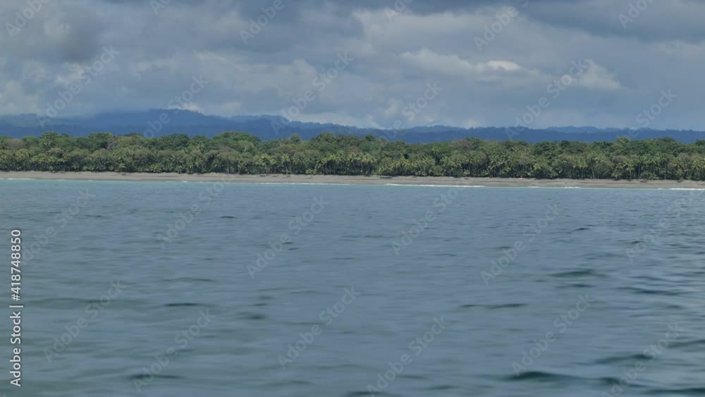 Empty Corcovado national park beach Costa Rica cloudy day view from the sea Empty Corcovado national park beach Costa Rica cloudy day view from the sea