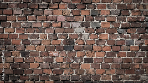 red brick wall with a visible texture. background