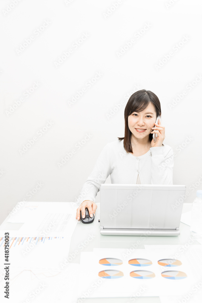 Woman making a work call on a mobile phone Woman making a work call on a mobile phone