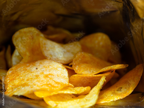 beautiful chips inside the bag. delicious slices of potatoes fried in butter. junk food.