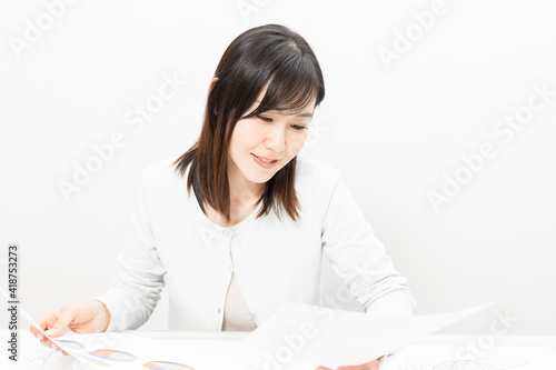 Woman viewing materials at a meeting