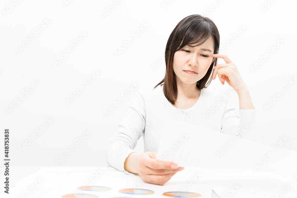 Woman thinking with a document at a meeting Woman thinking with a document at a meeting