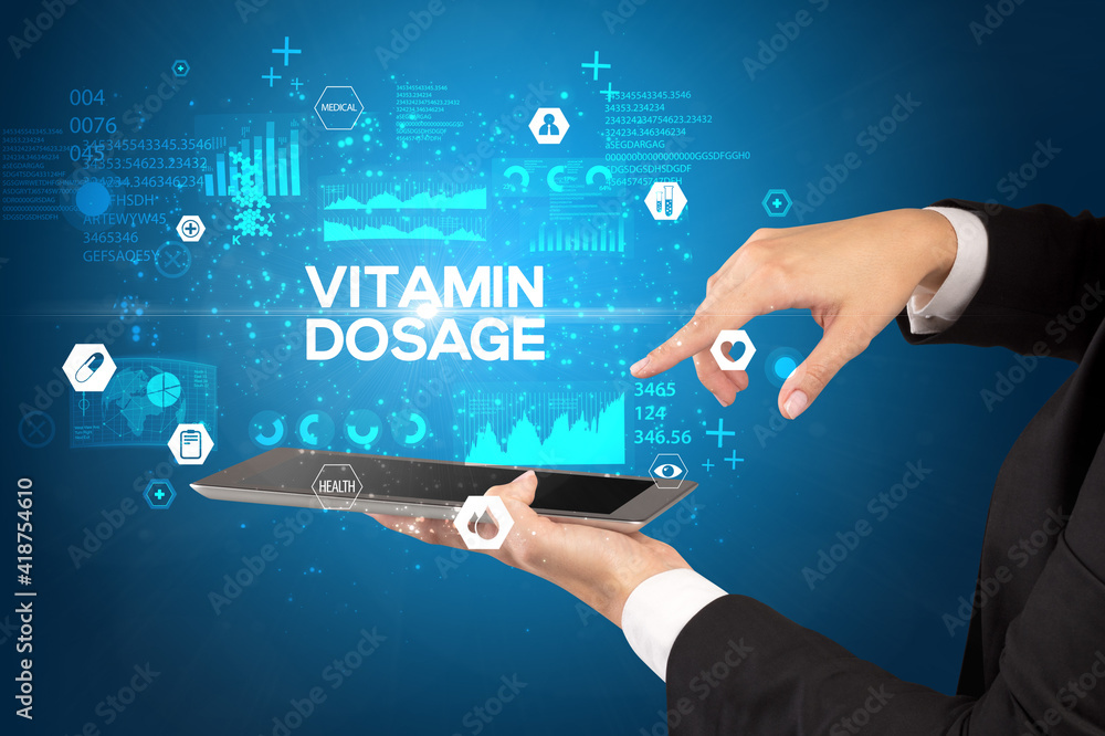 Close-up of a touchscreen with VITAMIN DOSAGE inscription, medical concept Close-up of a touchscreen with VITAMIN DOSAGE inscription, medical concept
