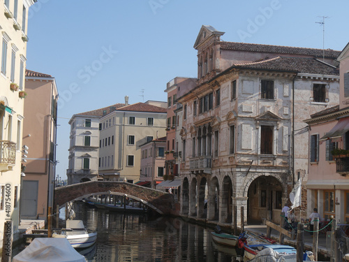 Chioggia, Vena Canal with colorful ancient buildings on both sides and Grassi Palace © filippoph
