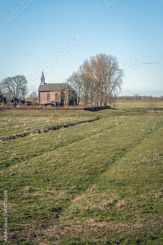 Protestant church built outside the dike on a mound near the Dutch village of Giessen, municipality of Altena, North Brabant. The church was rebuilt in 1856 using parts from the 14th century.