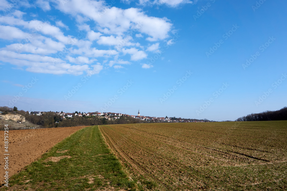 panoramic view of fields under blue sky