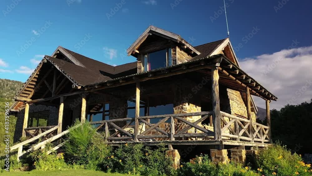 Shocking front of dreamy wood and stone house in mountains at sunset recorded in Slow motion 60fps Shocking front of dreamy wood and stone house in mountains at sunset recorded in Slow motion 60fps