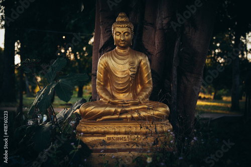 Buddha statue in thailand with sunlight on morning