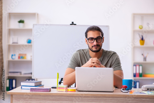 Young male designer working in the office