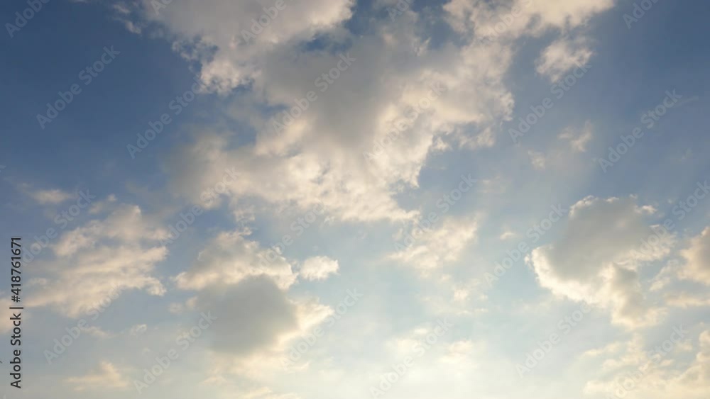 Golden sun light ray flare n bokeh sunbeam shining through puffy fluffy dark gray cloud n cumulus white cloudscape on colorful sunny sunrise or sunset pastel blue sky, 4k cinemagraphs b-roll TimeLapse Golden sun light ray flare n bokeh sunbeam shining through puffy fluffy dark gray cloud n cumulus white cloudscape on colorful sunny sunrise or sunset pastel blue sky, 4k cinemagraphs b-roll TimeLapse