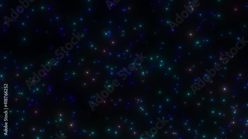 Numerous multicolored lights are streaming down from top to bottom on a black background. Magic starfall. photo