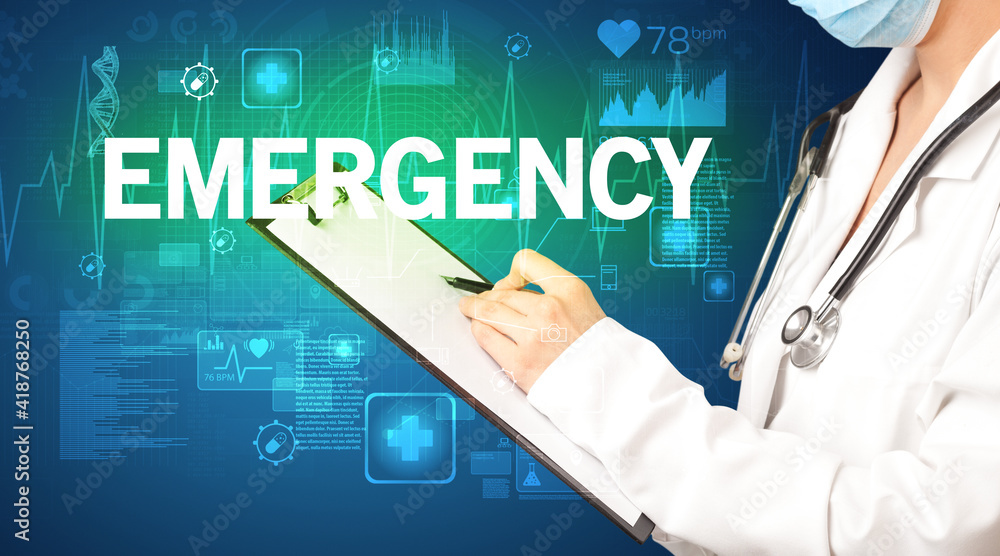 young doctor writing down notes with EMERGENCY inscription, healthcare concept young doctor writing down notes with EMERGENCY inscription, healthcare concept