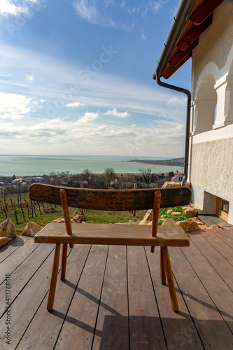 Beautiful view ot the Badacsony hill next to the Lake Balaton from above with an vineyard with a bench