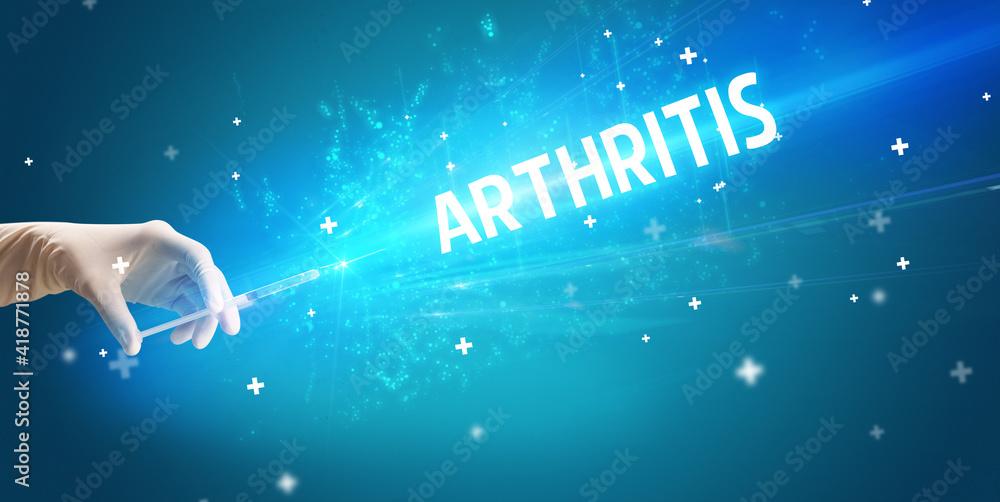 Syringe, medical injection in hand with ARTHRITIS inscription, medical antidote concept Syringe, medical injection in hand with ARTHRITIS inscription, medical antidote concept