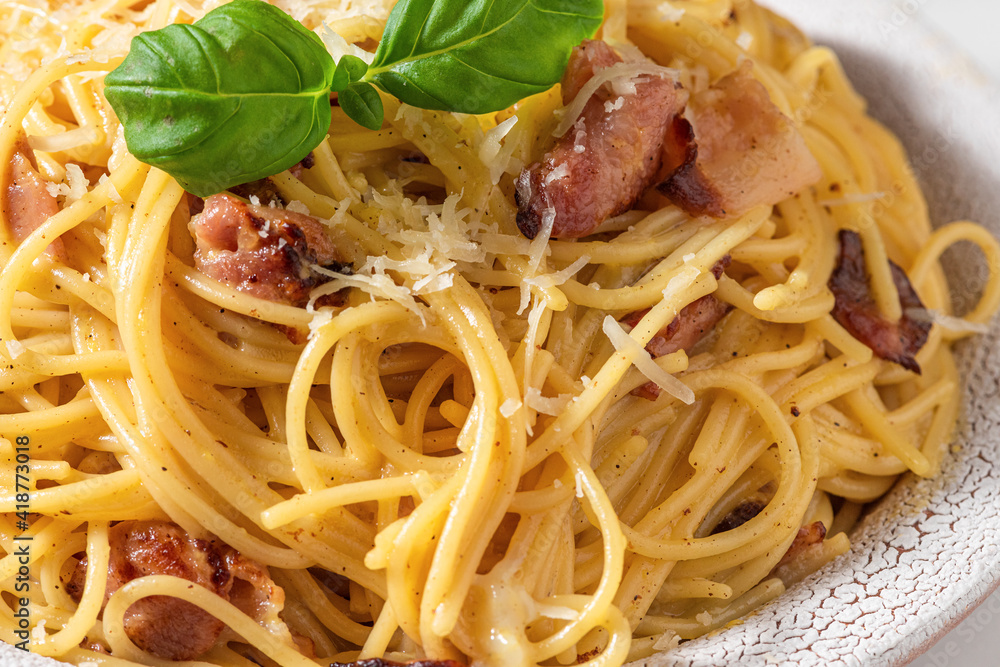 Pasta spaghetti carbonara with pancetta, egg, parmesan cheese, basil and cream sauce. Italian food Pasta spaghetti carbonara with pancetta, egg, parmesan cheese, basil and cream sauce. Italian food