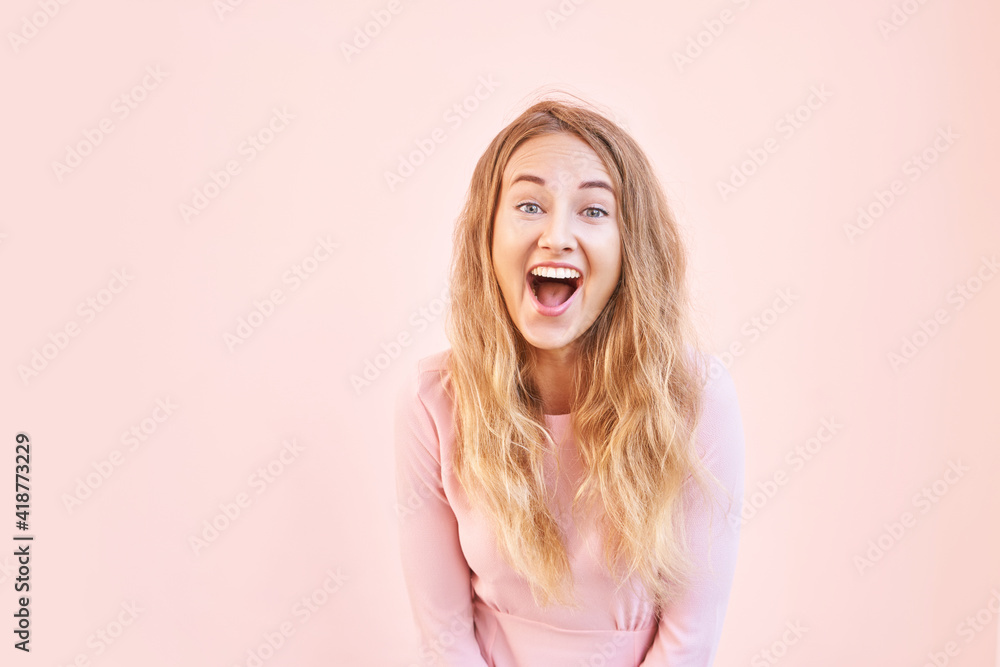 Pretty young woman amazed by sale news. Happy female person outdoors. Summer cute portrait. Lady blonde long hair. Cute adult student at town. Pink background. Copyspace. Wow female emotion Pretty young woman amazed by sale news. Happy female person outdoors. Summer cute portrait. Lady blonde long hair. Cute adult student at town. Pink background. Copyspace. Wow female emotion