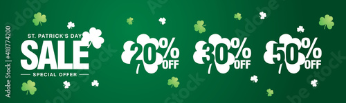 Saint Patricks Day Sale special offer 20 30 50 % off white green clover negative space discount numbers stickers dark green background