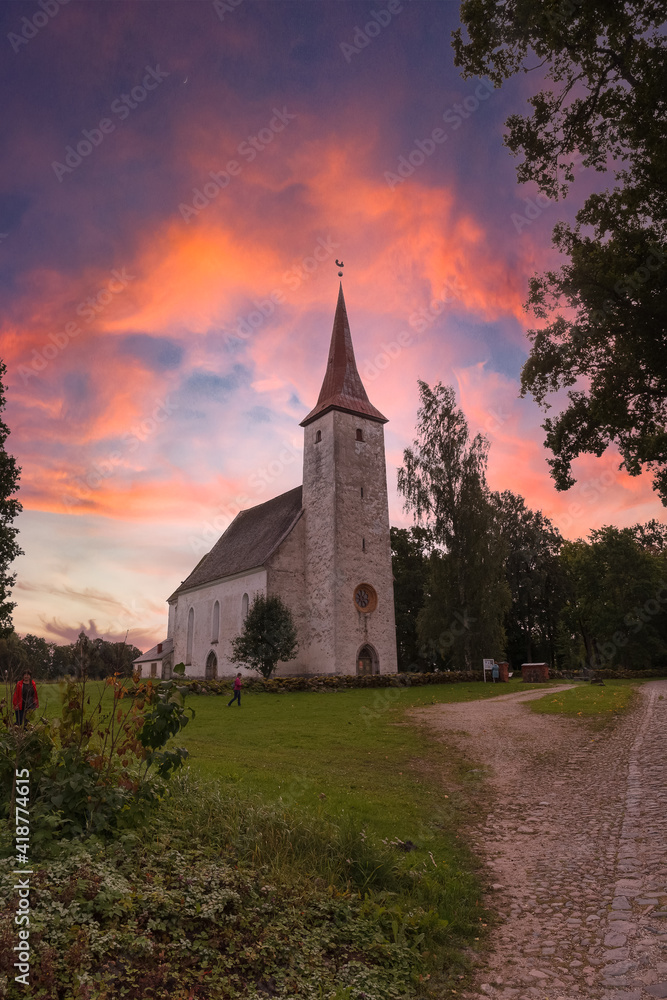Amazing sunrise sky over high rural church in Suure-Jaani, Estonia. Amazing sunrise sky over high rural church in Suure-Jaani, Estonia.